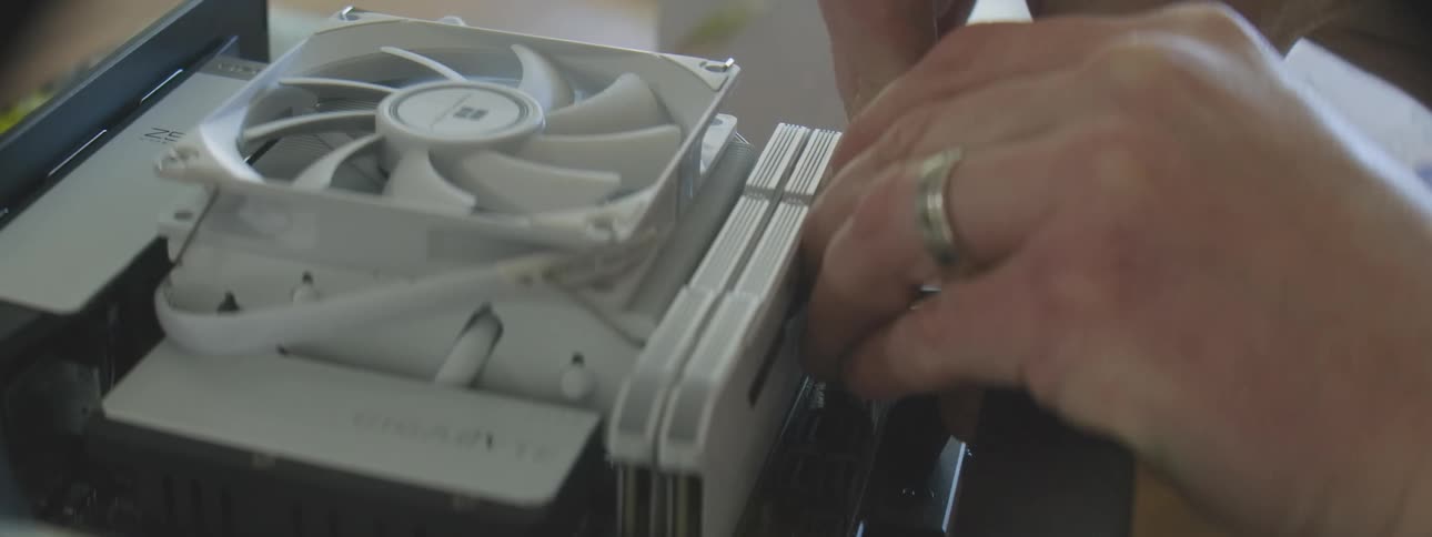 Hand plugging cables into computer hardware