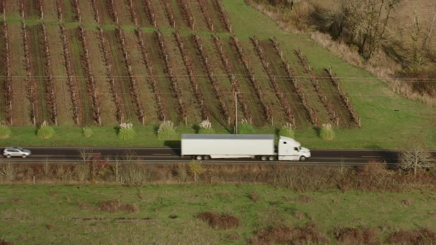 Traffic passes the large farm