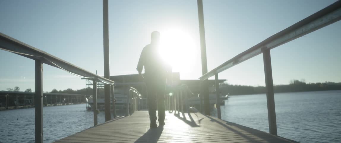 A person walking on a dock