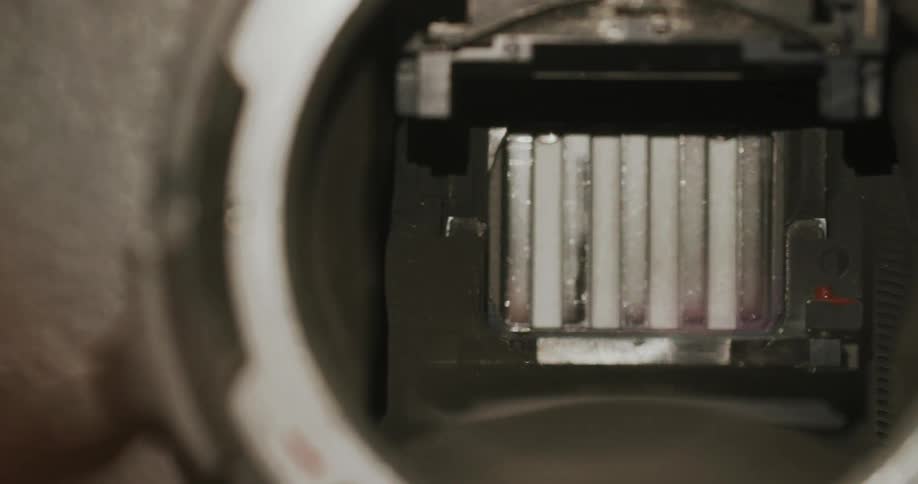 Detailed view of the inside of a camera showing the shutter and sensor