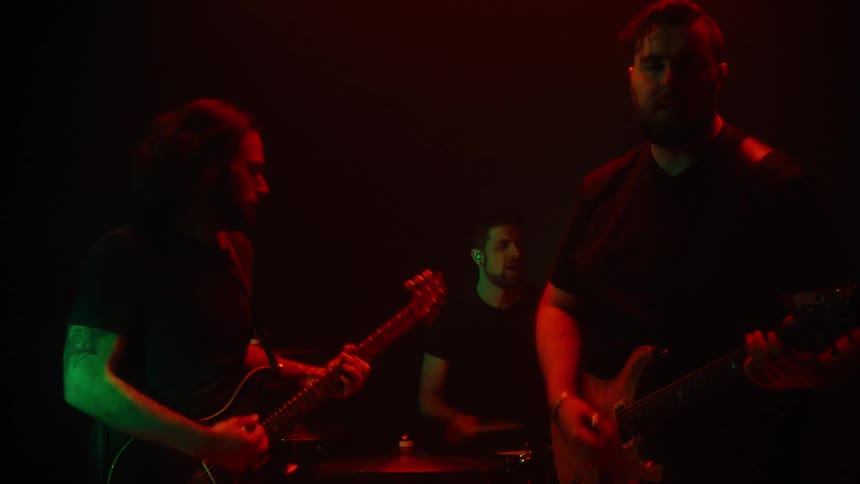 Threeman rock band performing