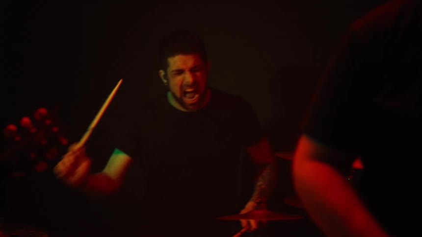 Band performing with guitar and drums