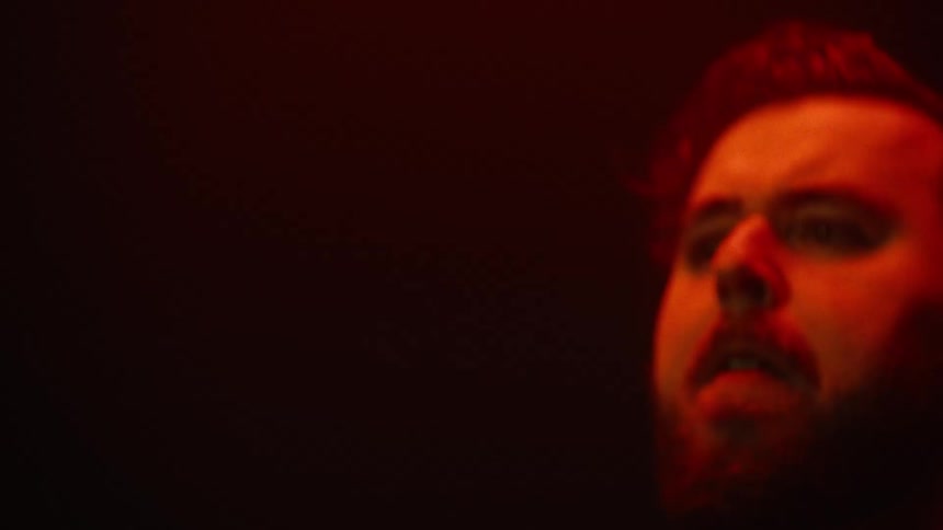 Two men in a rock band performance