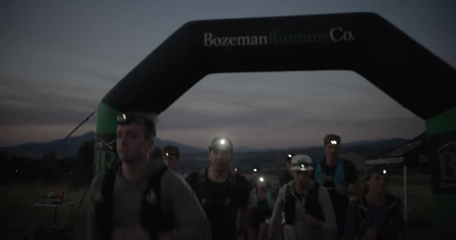 A group begin a race at sunrise
