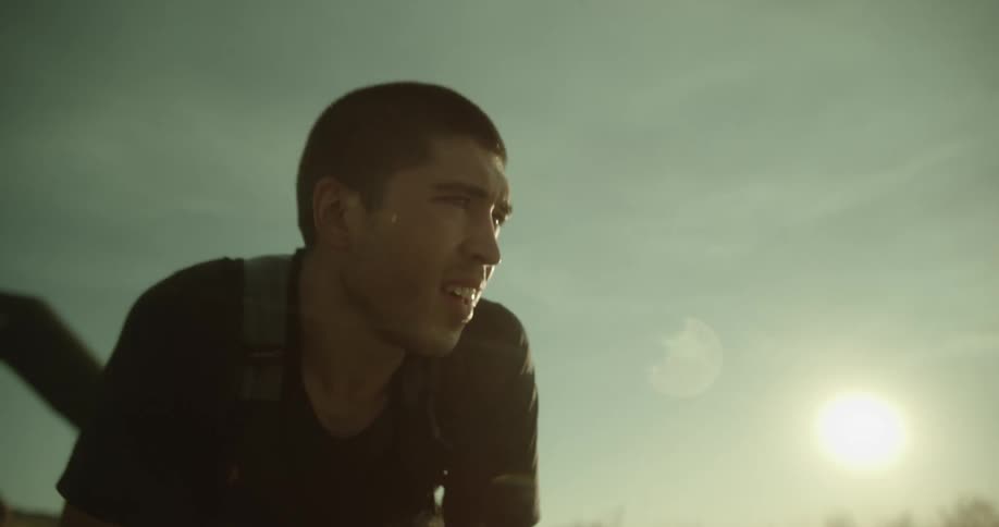 Man taking off his cap and breathing in the fresh air tired