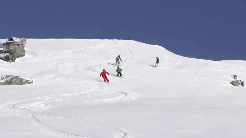 People skiing down a hill