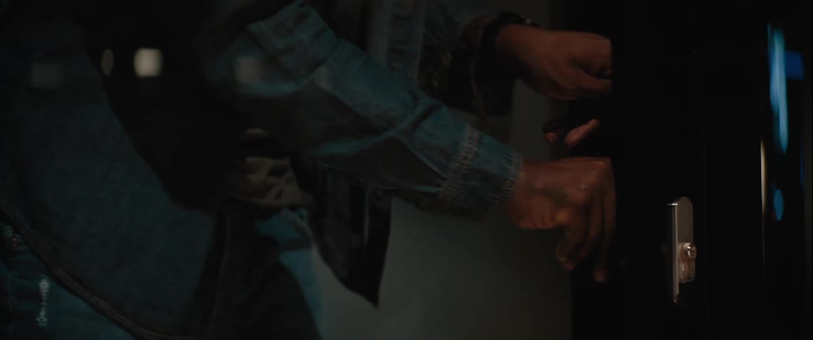 Man locking a glass door