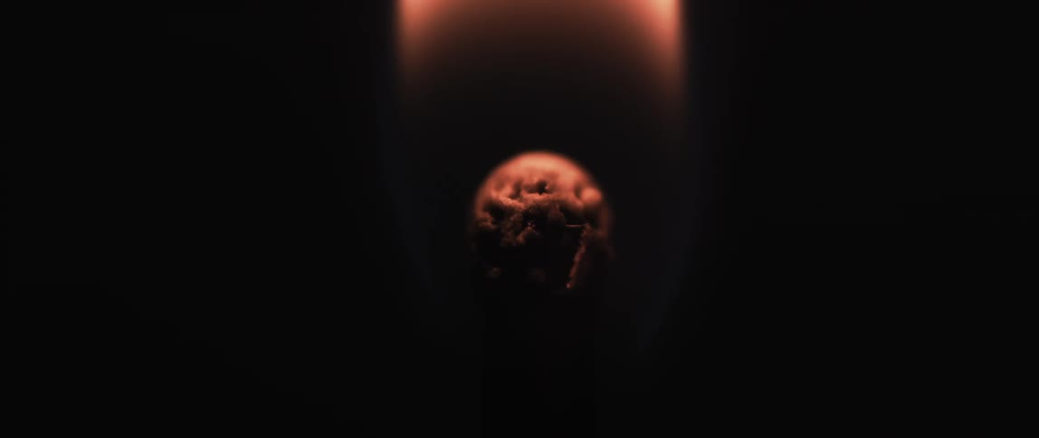Close up of matchstick being lit then burning off