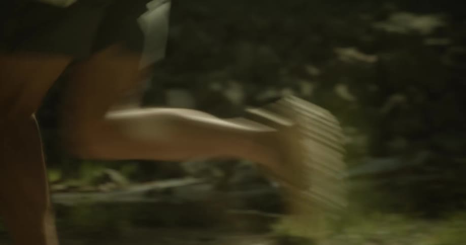 Legs of a person running on a trail