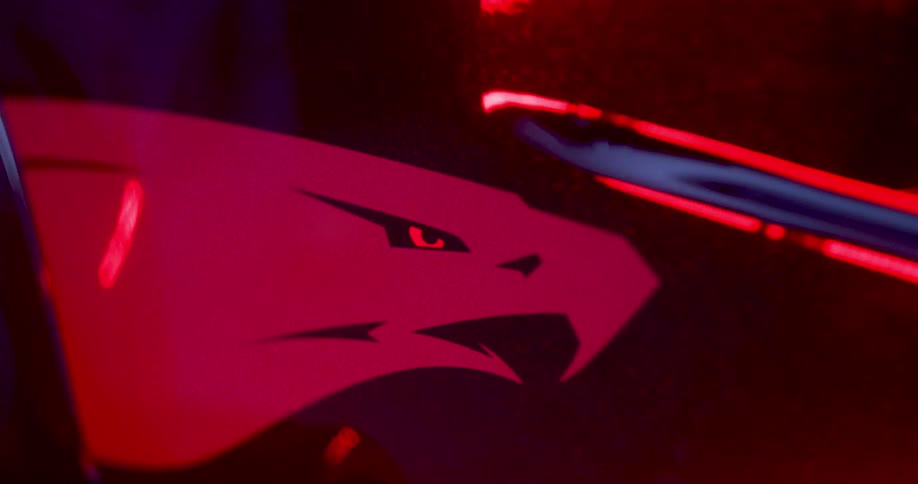 Light reflects off a symbol of an eagle on the vehicle