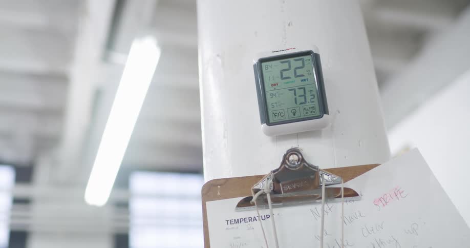 The screen of a device measuring temperature with some text in black