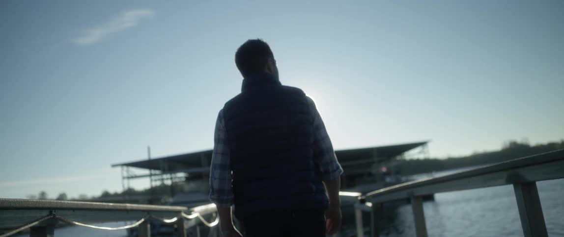 A person walking down a pier