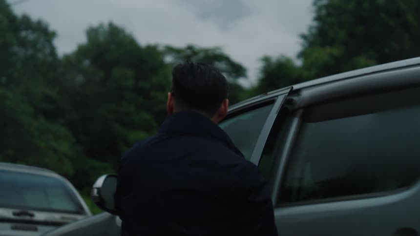 Man getting into a pickup truck