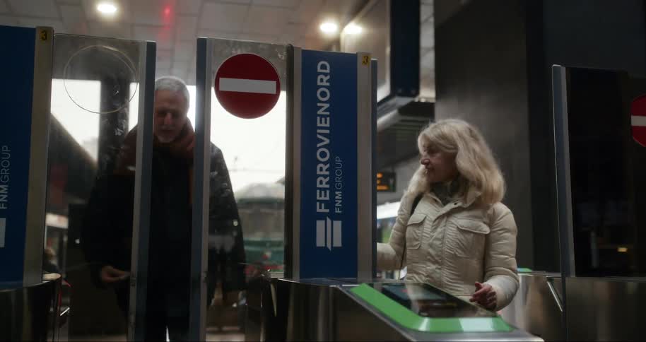 A footage of a man and a woman at the terminal