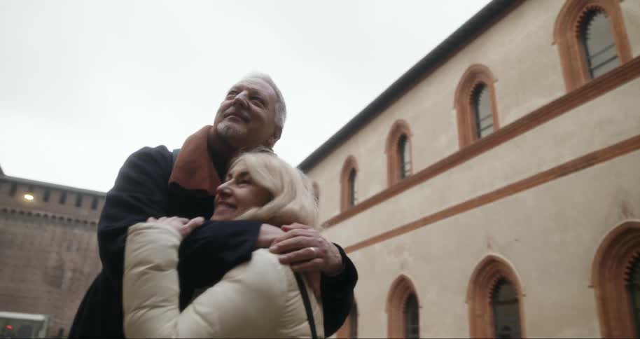 Couple hugging while traveling