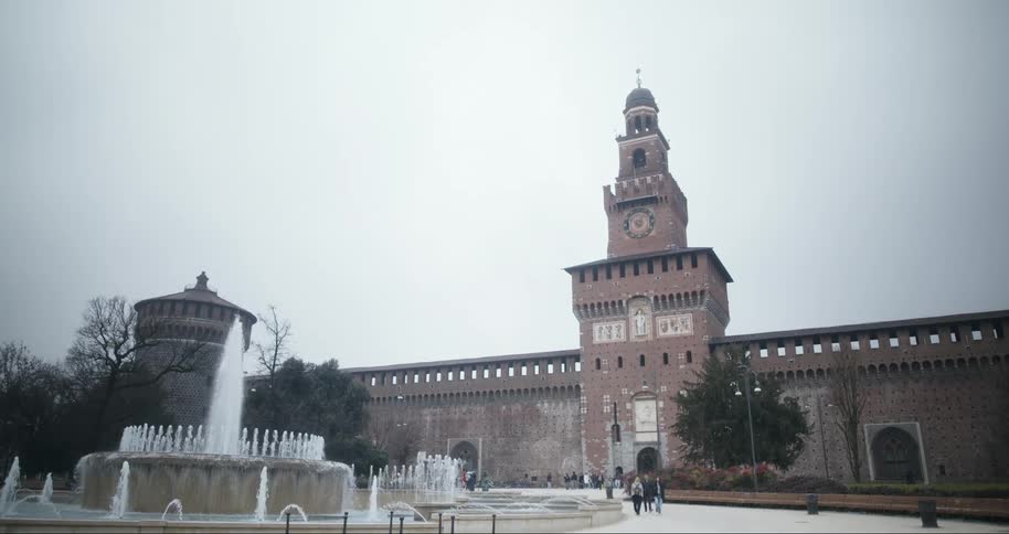 Fountain in front of the sforzesco castle in milan under a cloudy sky