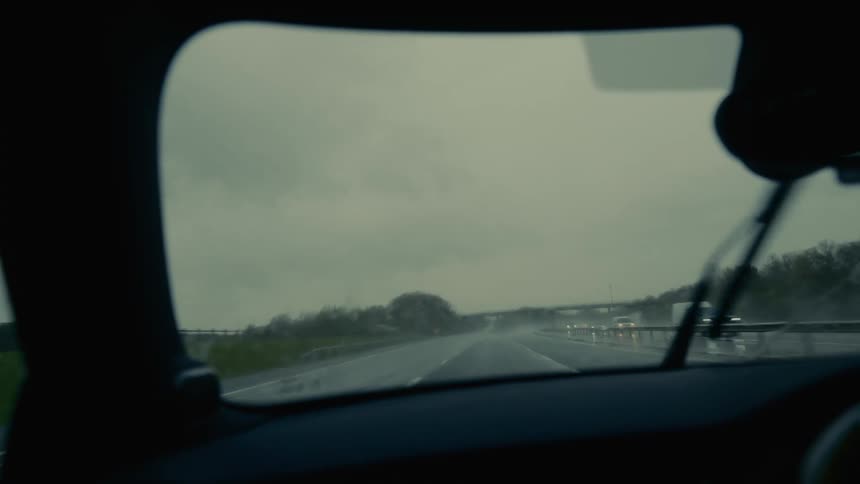 View from the windshield of a vehicle traveling on a highway