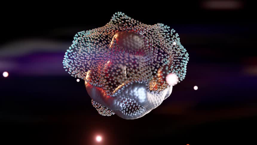 Computer graphics show a bloodlike sphere that changes shape as floating orbs surround it all set against a background of shifting colors
