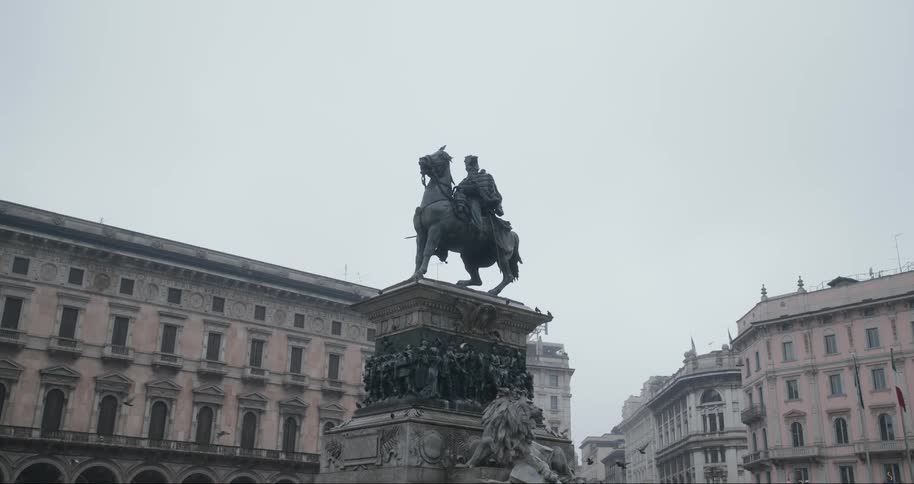 A footage of birds flying around a statue