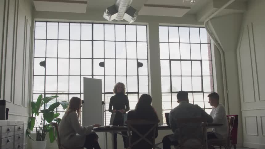 A footage of people having a meeting in the office