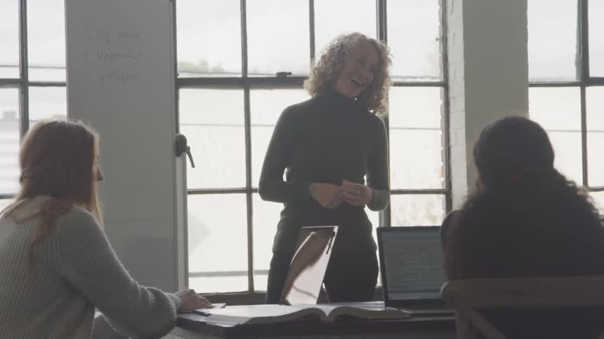 A footage of an office meeting between employees