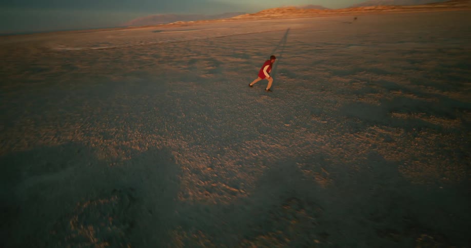 A man is dancing and jumping around