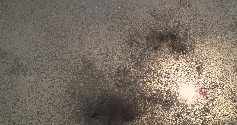 Liquid splashes up in droplets into the air