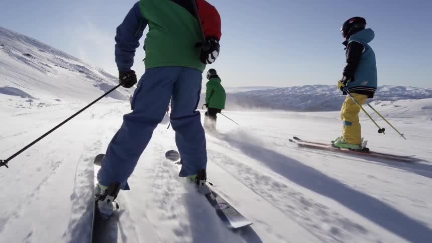 People skiing down a hill