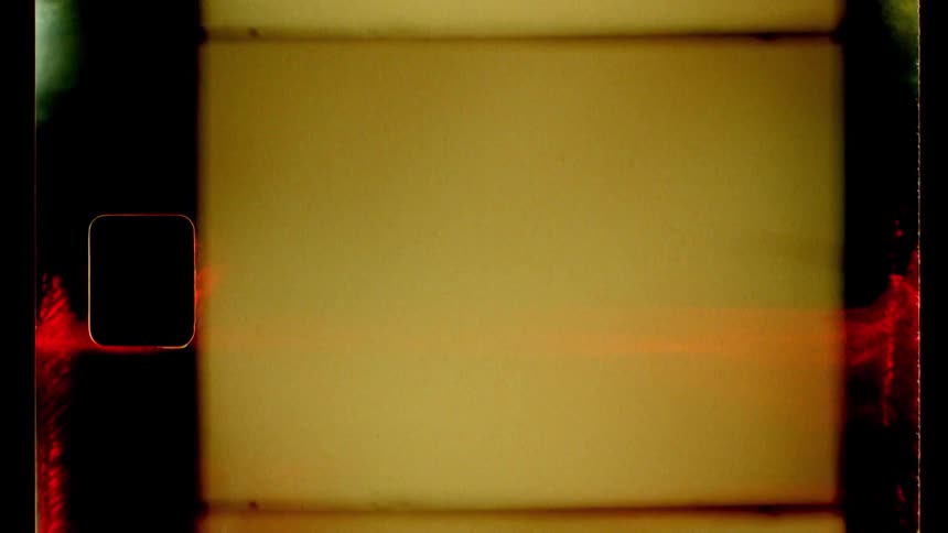 A closeup of a film strip with blank and blurry frames