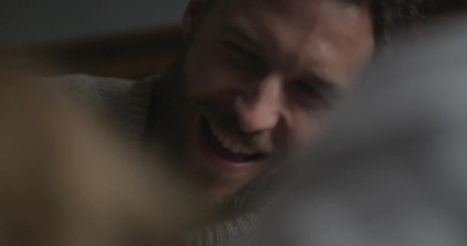 A man smiles