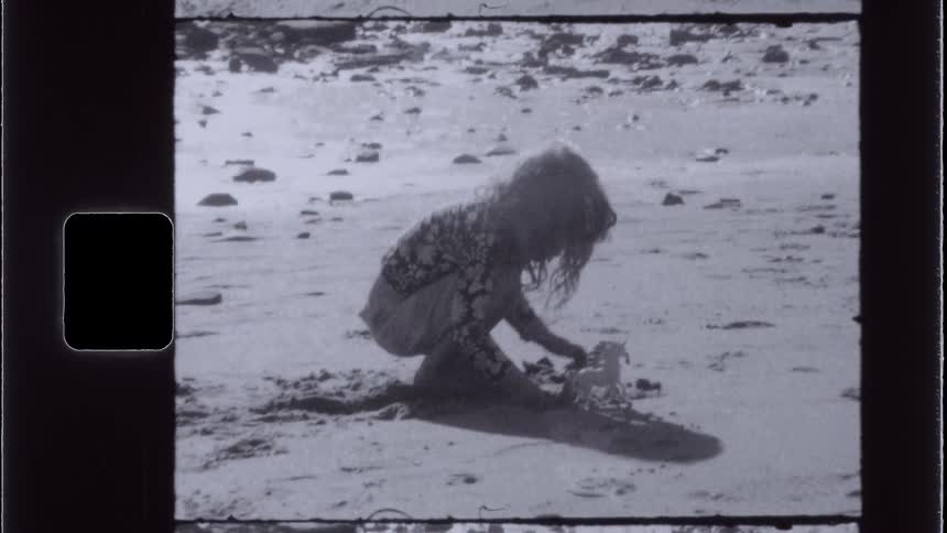 A footage of a child playing with the soil