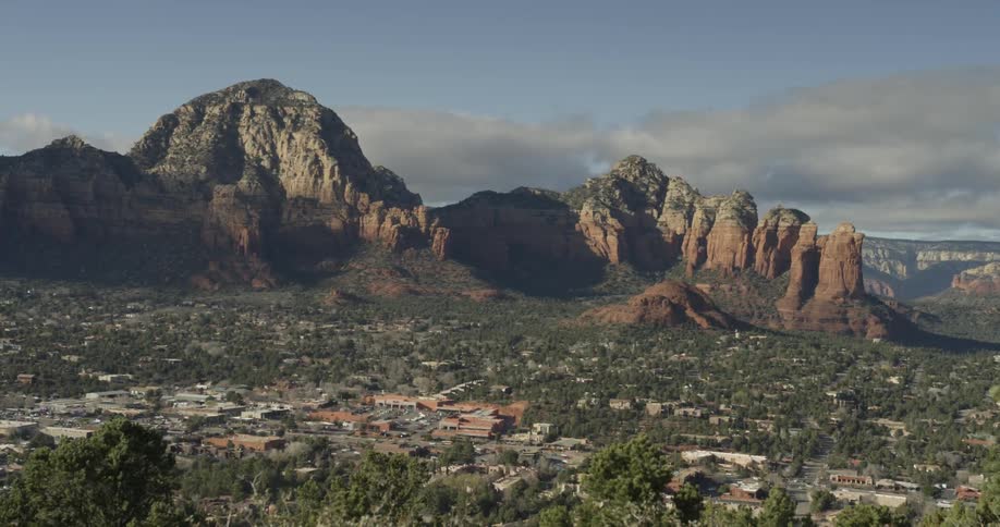 A view of some mountains and a city below