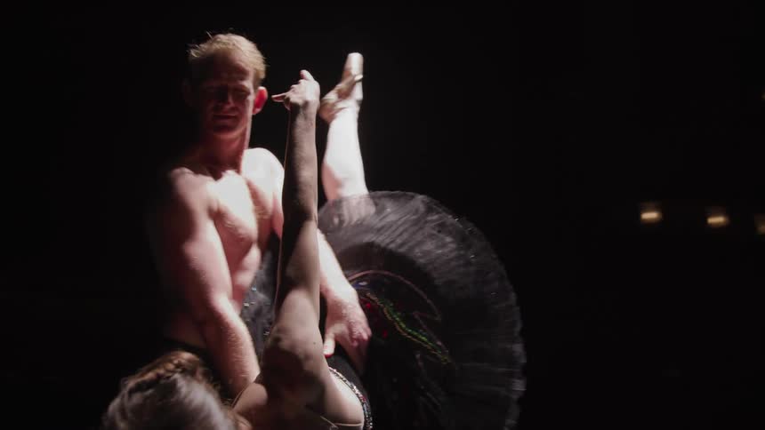 A clip of a male and female bale dancers on the stage