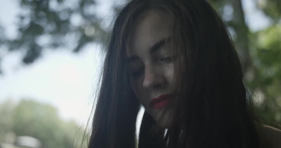 Dark haired woman with red lips