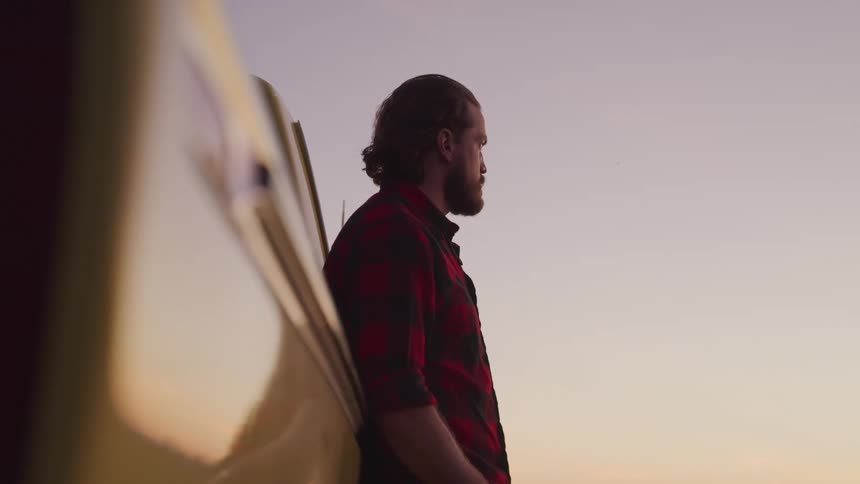 A footage of a man brooding outdoor