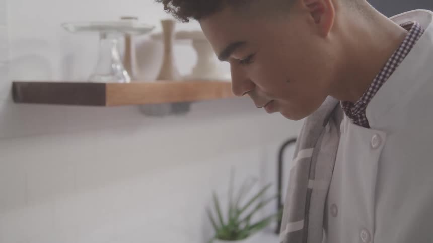 A man is cooking in the kitchen