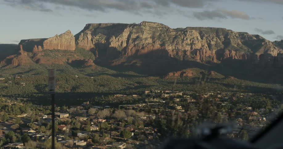 Small town sitting below a large mountain range