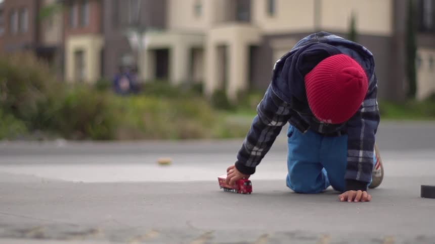 A kid playing with a toy