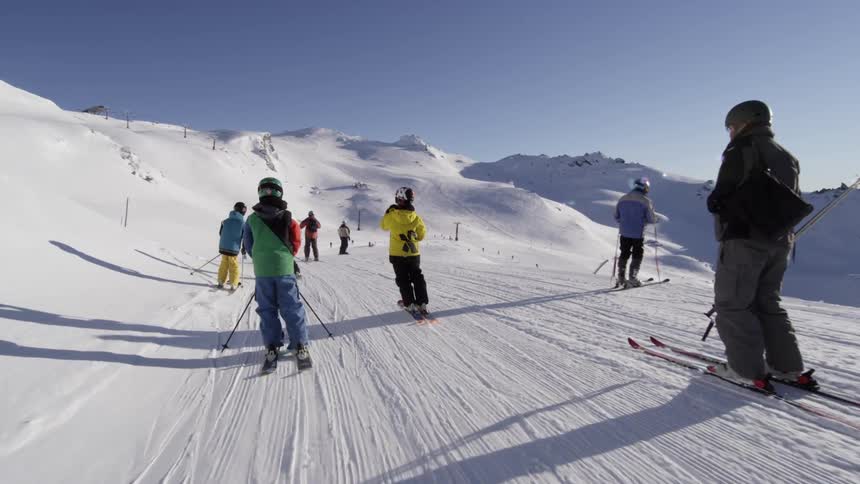 People skiing down a hill