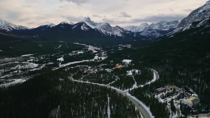 An aerial view of Kananaskis Village in the valley during the winter