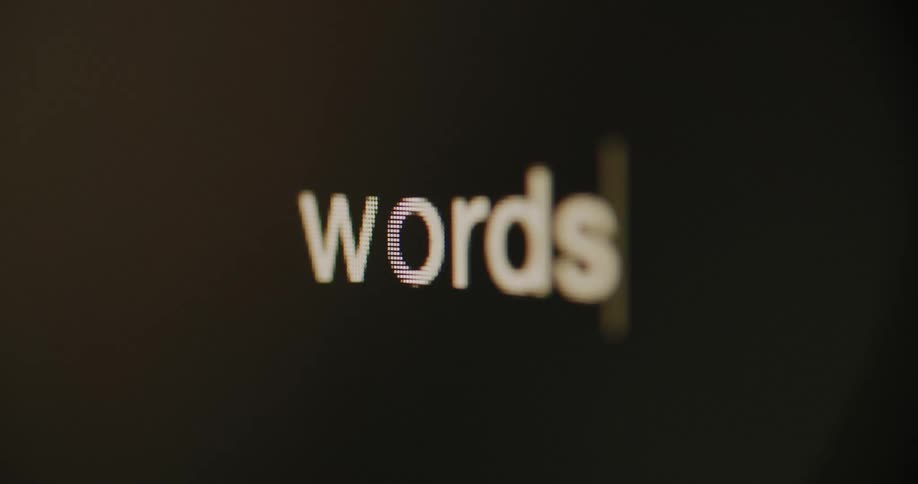 Close up of the word words being typed on a computer screen