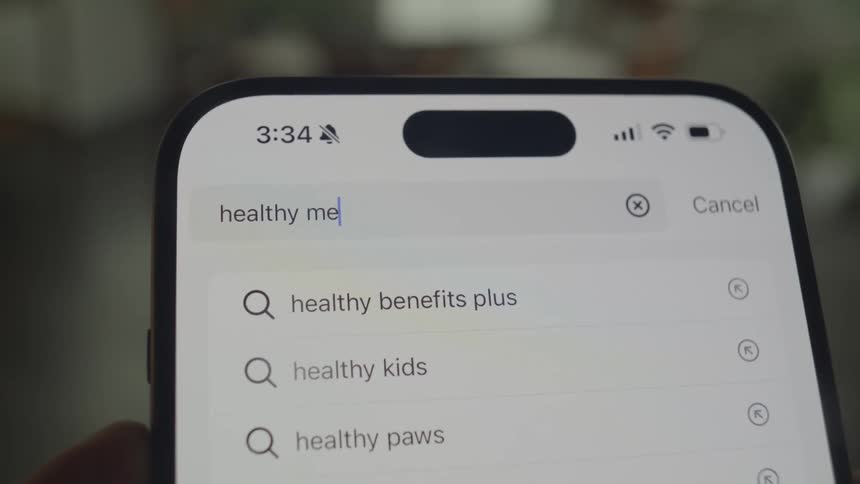 Words are typed into the search bar on a phone