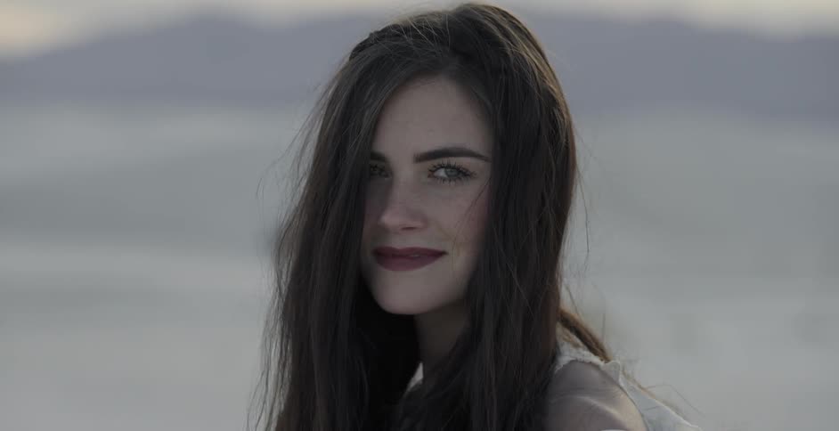 Dark haired woman smiling