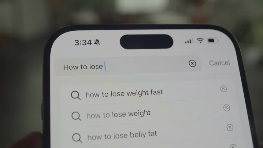 A search engine is being used on the cell phone