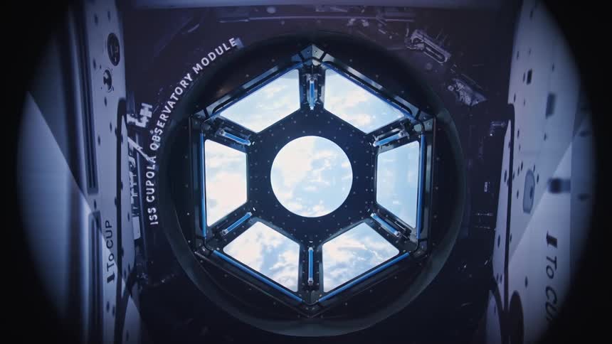 International space station view port looks out onto the iss cupola observatory module