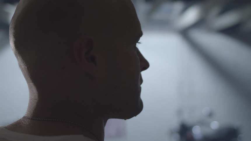 Side portrait of a sweaty man