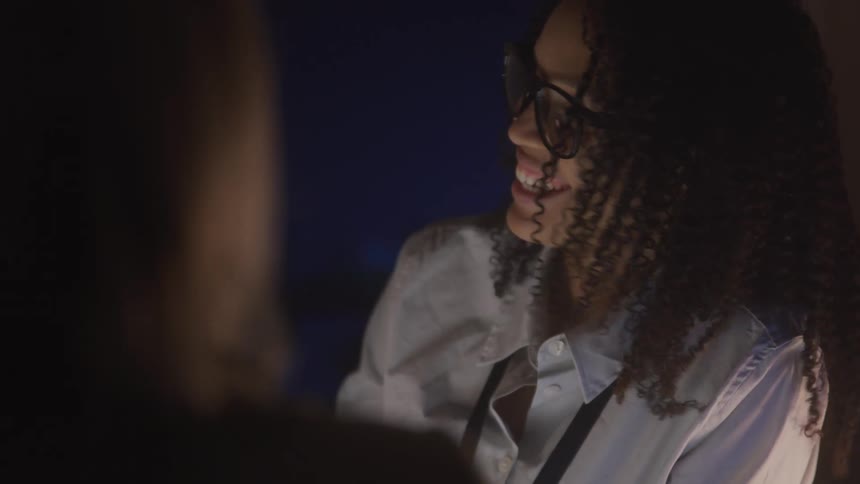 Two women are talking and laughing