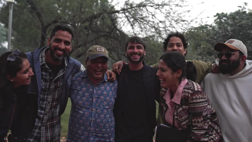 Group of happy friends hugging together