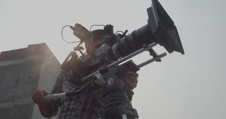 A cameraman filming