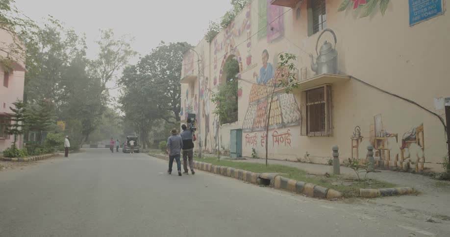 People walk down the road in town
